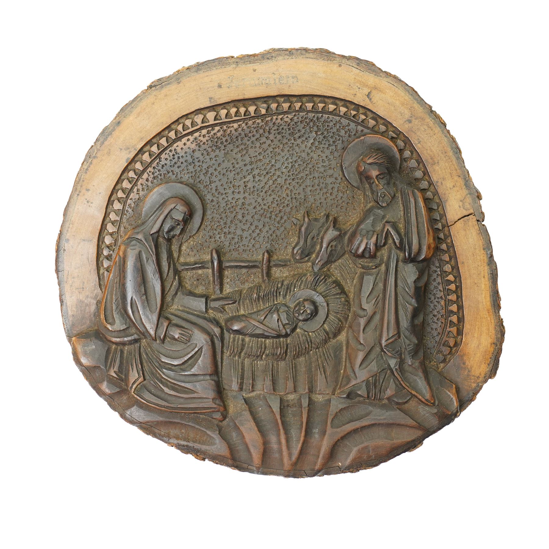 Italian olive wood plaque carved with a manger scene D13cm, continental silver plated processional finial formed as BVM and child and an Italian carved polychrome figure of a saint H15cm (3)
