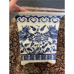 Chinese blue and white planter and stand, each of square slightly tapering and flared form, the planter decorated with two dragons and blossoming peonies, between stylised borders, the stand decorated with flower heads and vines, planter H30cm W29cm, stand H7cm D28.5cm