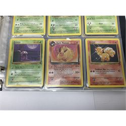 Collection of Pokemon trading cards, mostly 1999 Wizards Pokemon cards to include holo Charizard 4/102, first edition holo Machamp 8/102, further holographic cards; Dark Flareon 35/82 and Dark Vaporeon 45/82, cards from themed sets and 4th edition prints; 1998 Electronic Pokédex with cardboard boxes for themed decks Blackout, Overgrowth and Power Reserve Jungle, along with a large quantity of energy and trainer cards 
