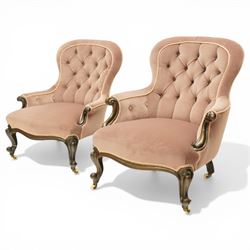 Pair of Victorian mahogany framed salon armchairs, spoon-back and sprung seat upholstered in buttoned lavender velour fabric with pink piping, shaped apron on cabriole legs with scroll feet and ceramic castors