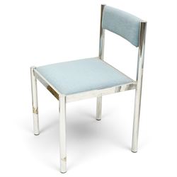 Set of eight 1980s chrome and upholstered dining chairs, curved back bar over padded seats upholstered in blue fabric, on tubular chrome frames