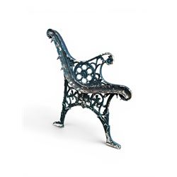 Pair of ornate painted cast iron bench ends, painted in green