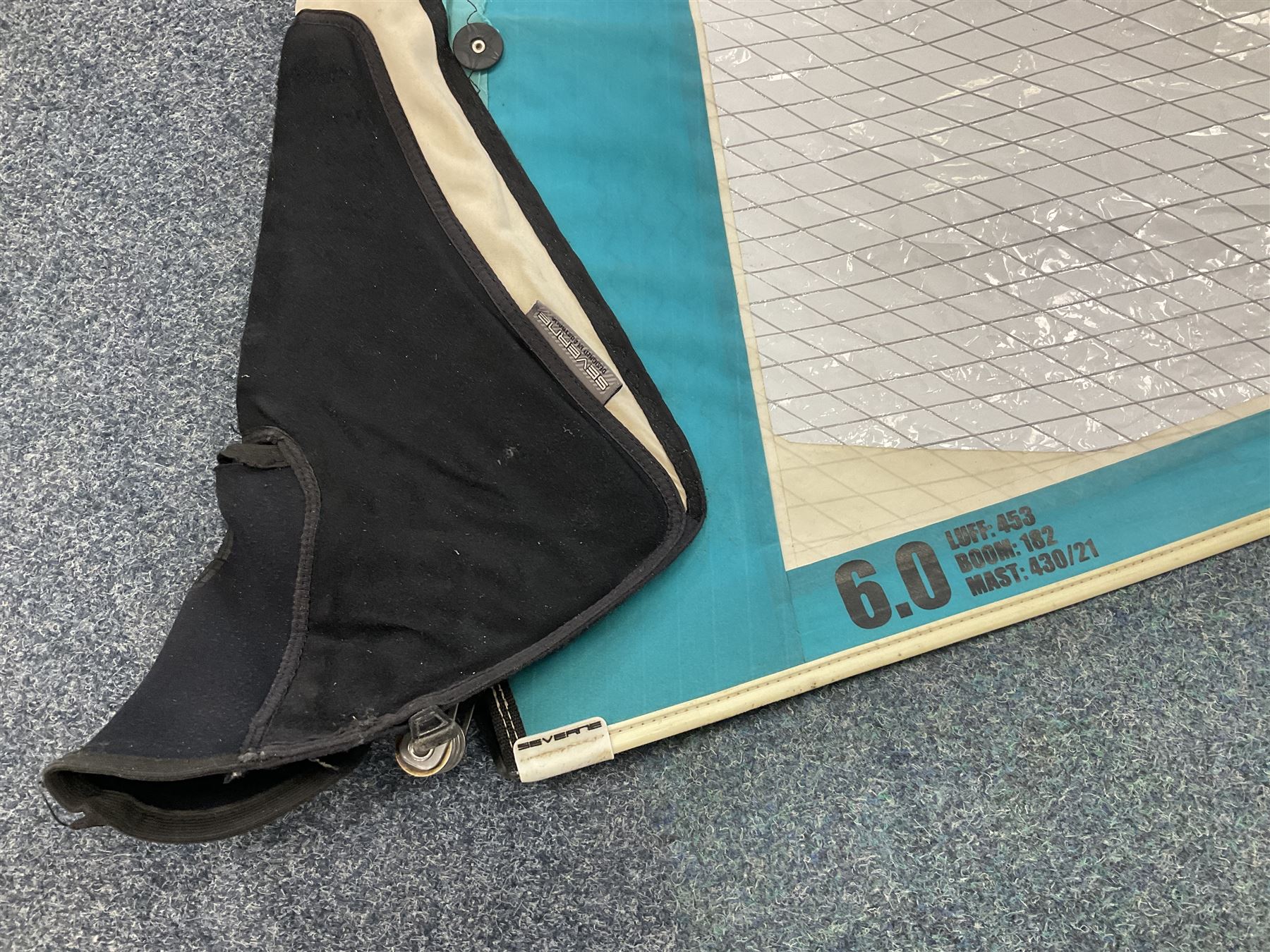 Windsurfing: Quantity of sails and masts comprising Severne Gator sail, mast 430/21 size 6.0, luff 453, boom 182, carbon Redline Severne 430 RDM mast, Tushingham Rock sail and Tushingham Free Wave mast, Tunshingham The Rock 4.2 sail, some with carrying cases, together with other equipment to include Severne Wave Grenade extension, other extensions etc