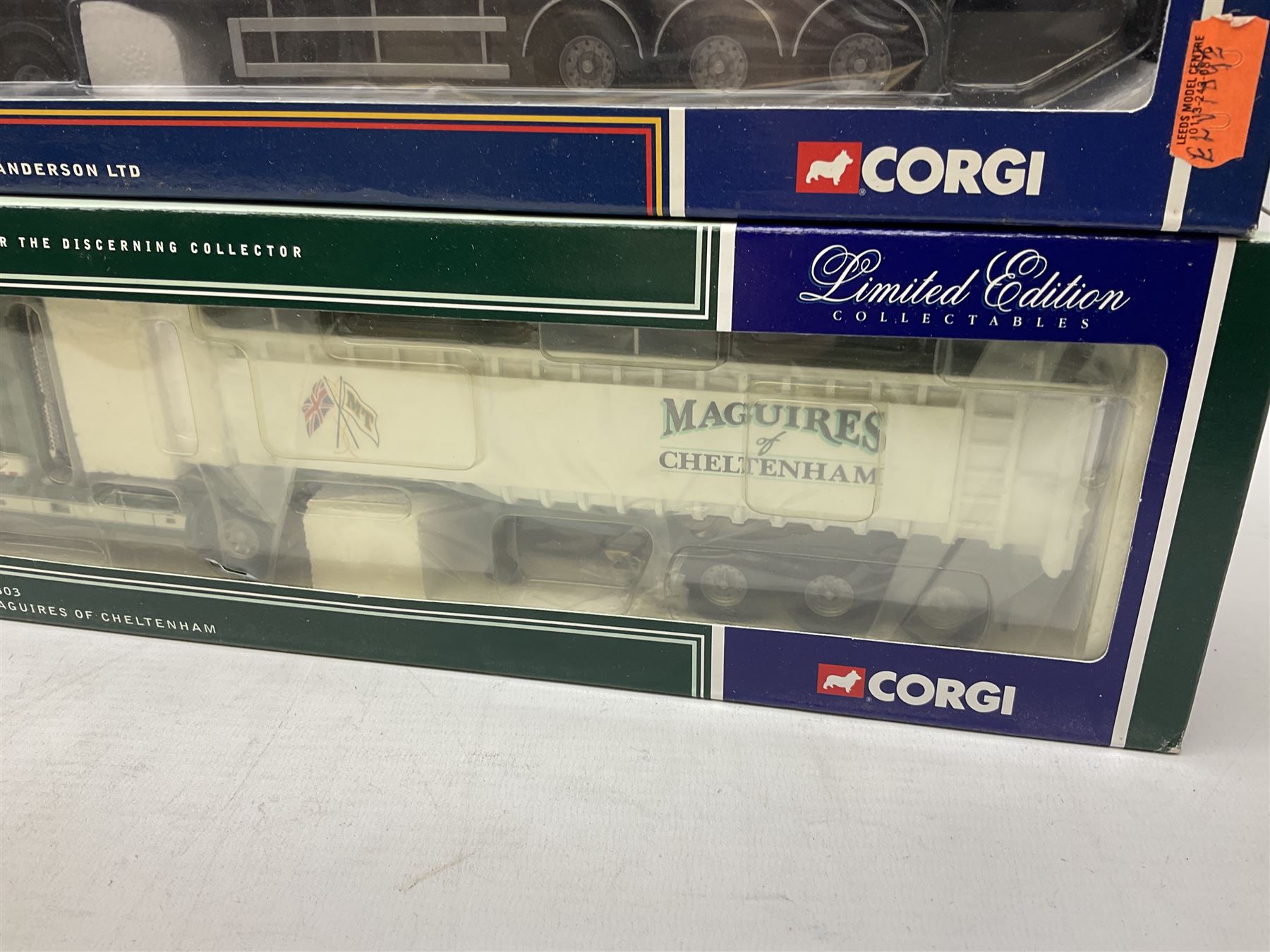 Three Corgi 1:50 scale lorries - ERF Tanker - Gulf Oil in perspex display case No.75101; limited edition Scania T Bulk Tipper - Maguires of Cheltenham No.CC12803; and Scania Topline Curtainside - Stephen Sanderson Limited No.CC12912; all boxed (3)