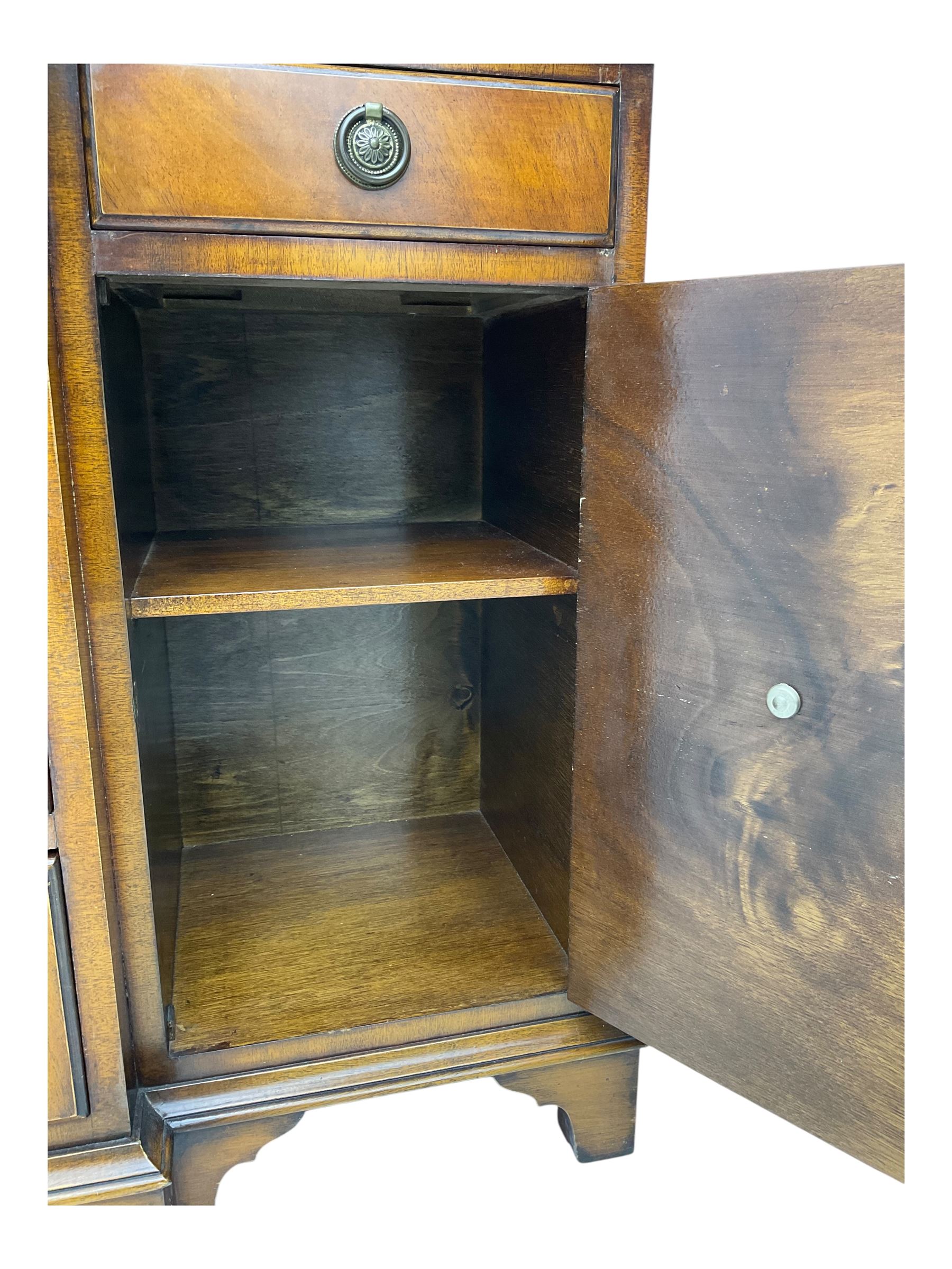 Georgian design mahogany break-front sideboard, fitted with six drawers and two cupboards, on bracket feet 
