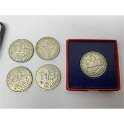 Six King George V 1935 silver crown coins, one housed in red card box and one in blue hinged case with gilt lettering to the front