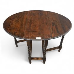 20th century oak gateleg table, with oval fold-out top supported on turned barley twist legs and stretchers (Extended 116cm)