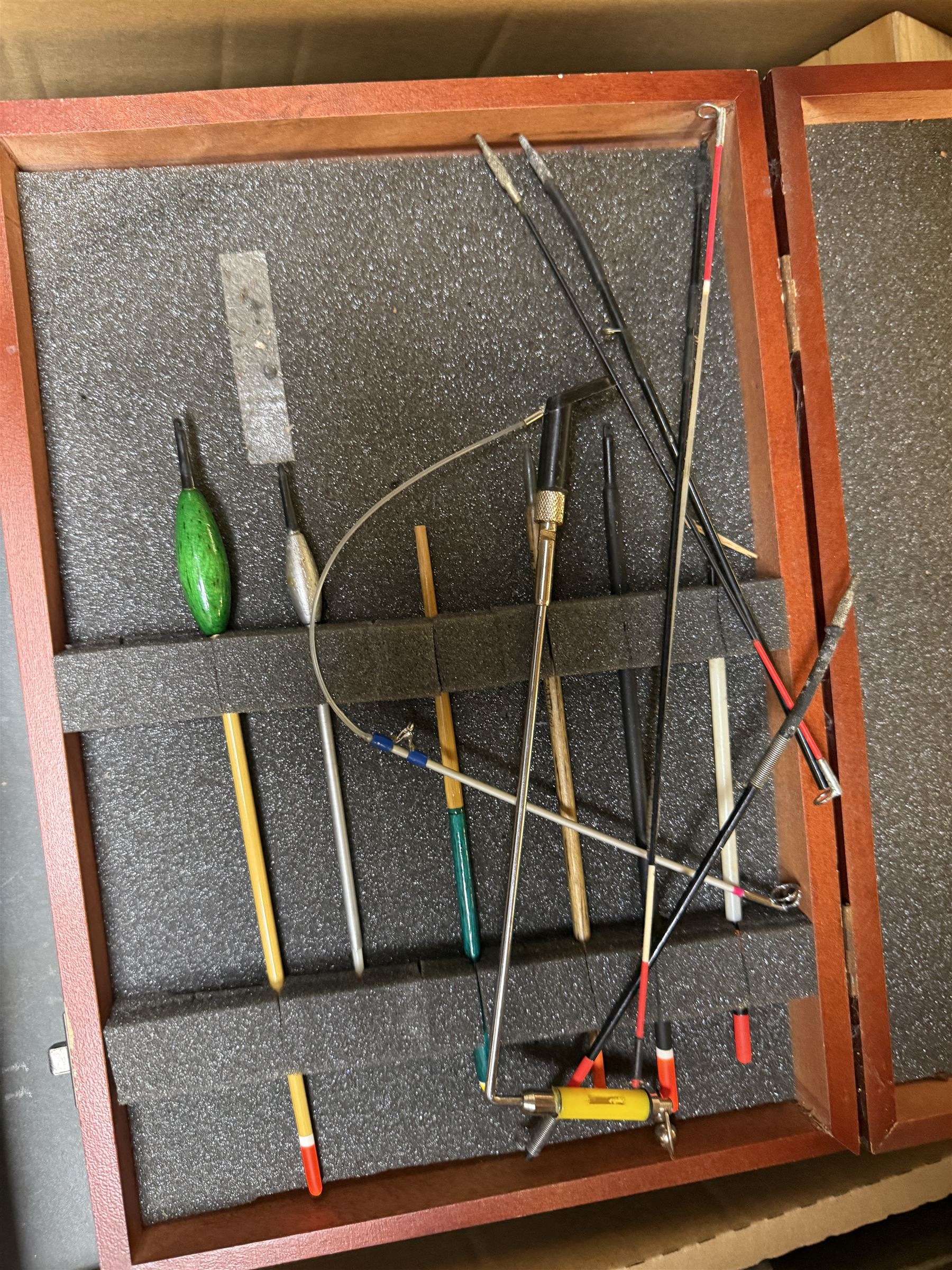 Collection of fishing equipment, including lures, floats and flies 