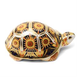 Royal Crown Derby paperweights, Galapagos Penguin limited edition 177/1000 and Madagascan Tortoise 177/1000, both from the Endangered Species series with gold stoppers and certificates