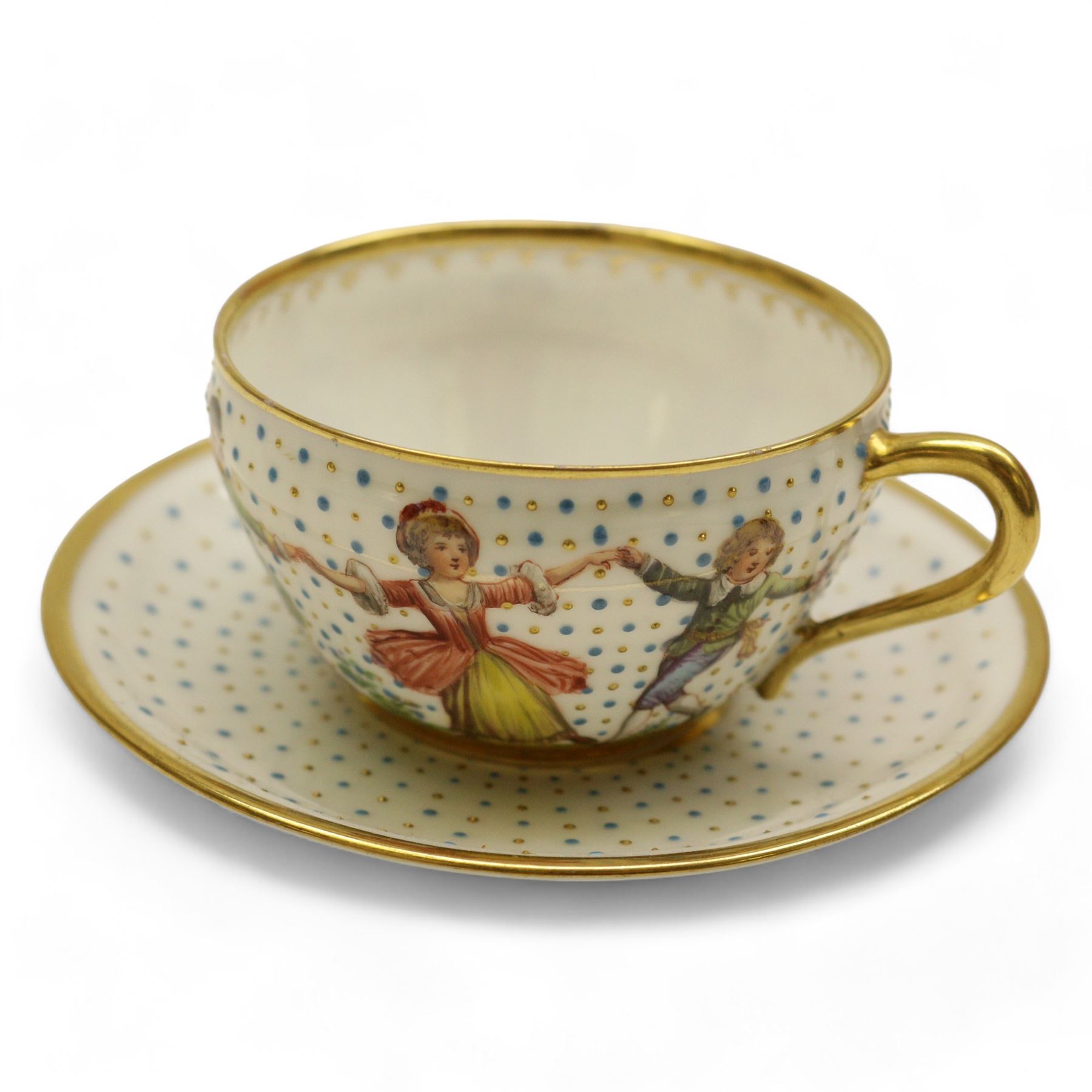 Four early 19th century Dresden cups and saucers, comprising twin handled chocolate cup and cover, decorated with floral swags, cup and saucer decorated with children dancing and two others 