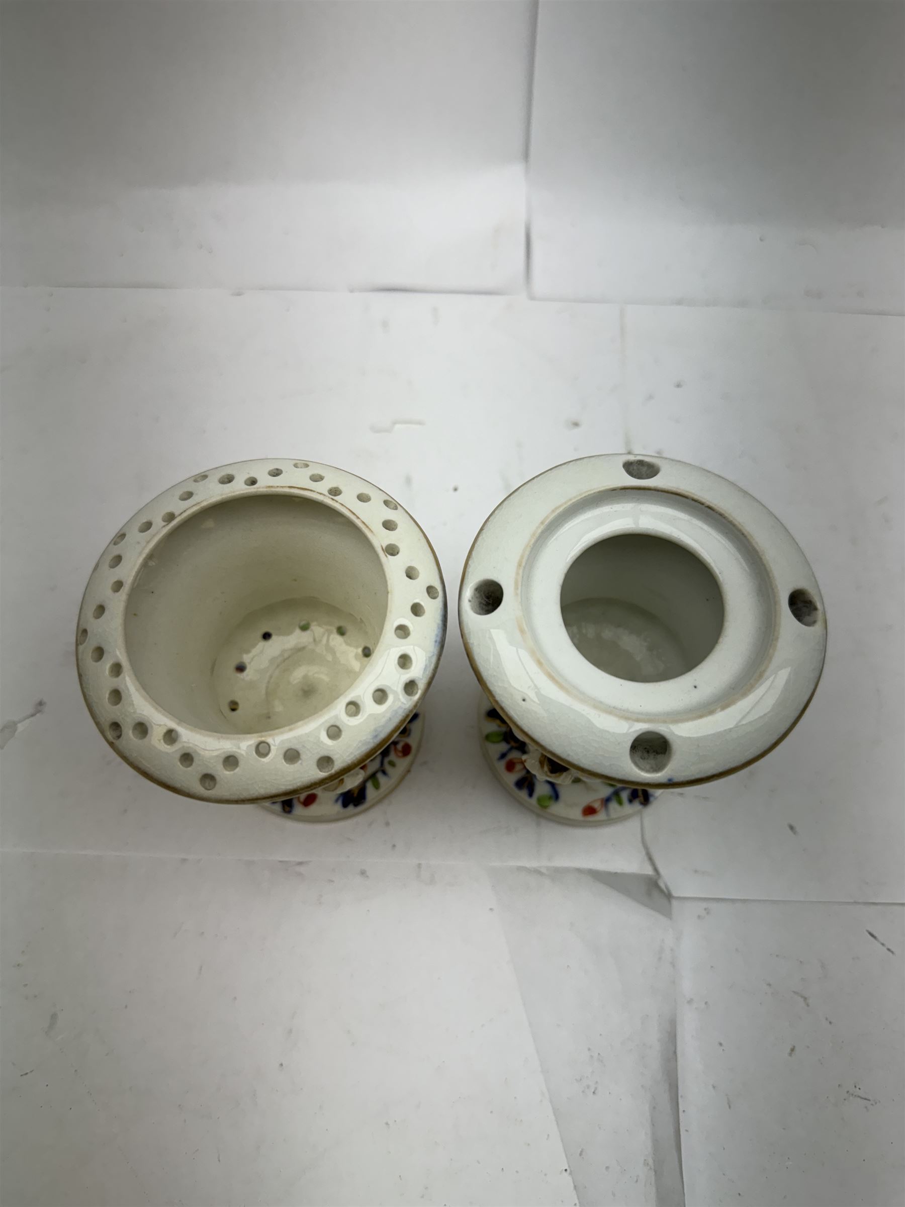 Pair of Staffordshire figures modelled as chained Dalmatians seated upon cobalt blue oval bases, H13cm, together with a Staffordshire pastille burner modelled as a castle, H12cm, a pair of 19th century Derby potpourri pots (lacking covers), and an 18th century blue and white tea bowl 