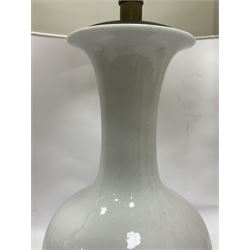 Pair of Chinese ivory crackle glazed table lamps, each of bottle form, raised upon circular hardwood base, excluding fittings H43cm