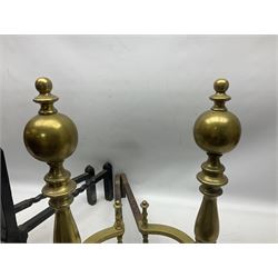 Pair of wrought iron fire dogs with fleur-de-lis finials upon twisted stems, together with pair of brass fire dogs etc, tallest H56cm