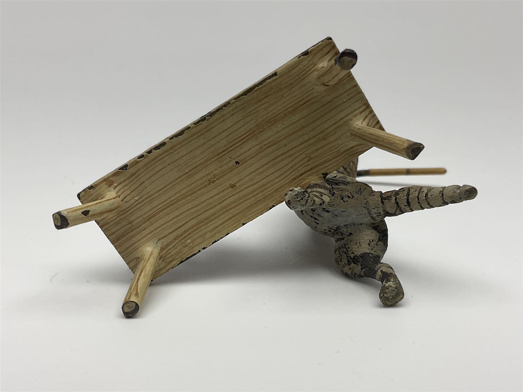 After Bergmann, two cold painted bronze figures, the first modelled as two cats on a bench hugging, the second a cat caning a kitten