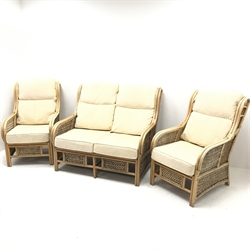 Two seat cane and bamboo conservatory sofa, cushions upholstered in pale gold (W122cm) and pair matching armchairs (W67cm)
