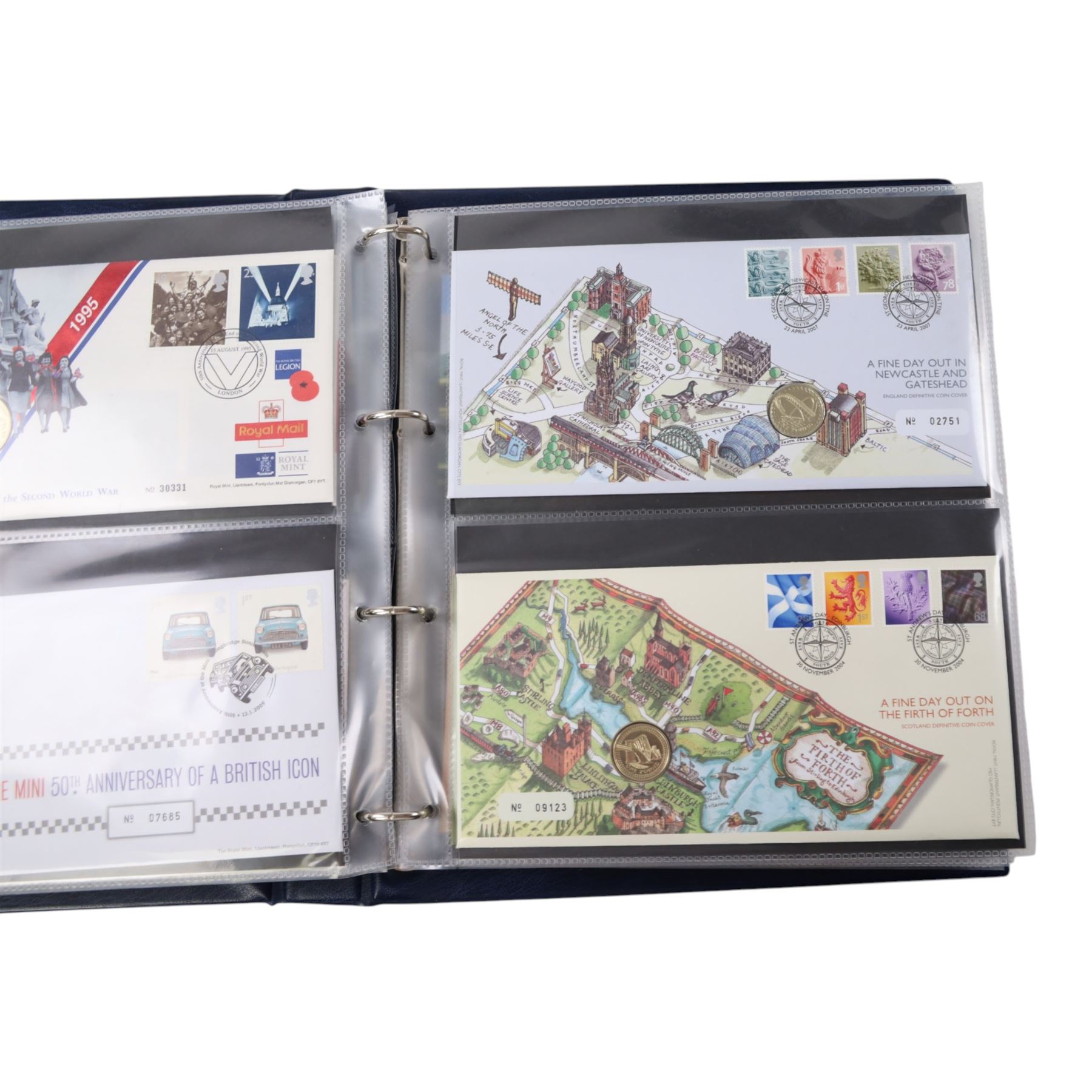 Approximately 104 Royal Mail Royal Mint coin or medallion covers, housed in an official Royal Mail Royal Mint ring binder folder and loose, together with The Queen's Golden Jubilee Coin Cover Collection in two albums, commemorative fifty pences, crowns, etc