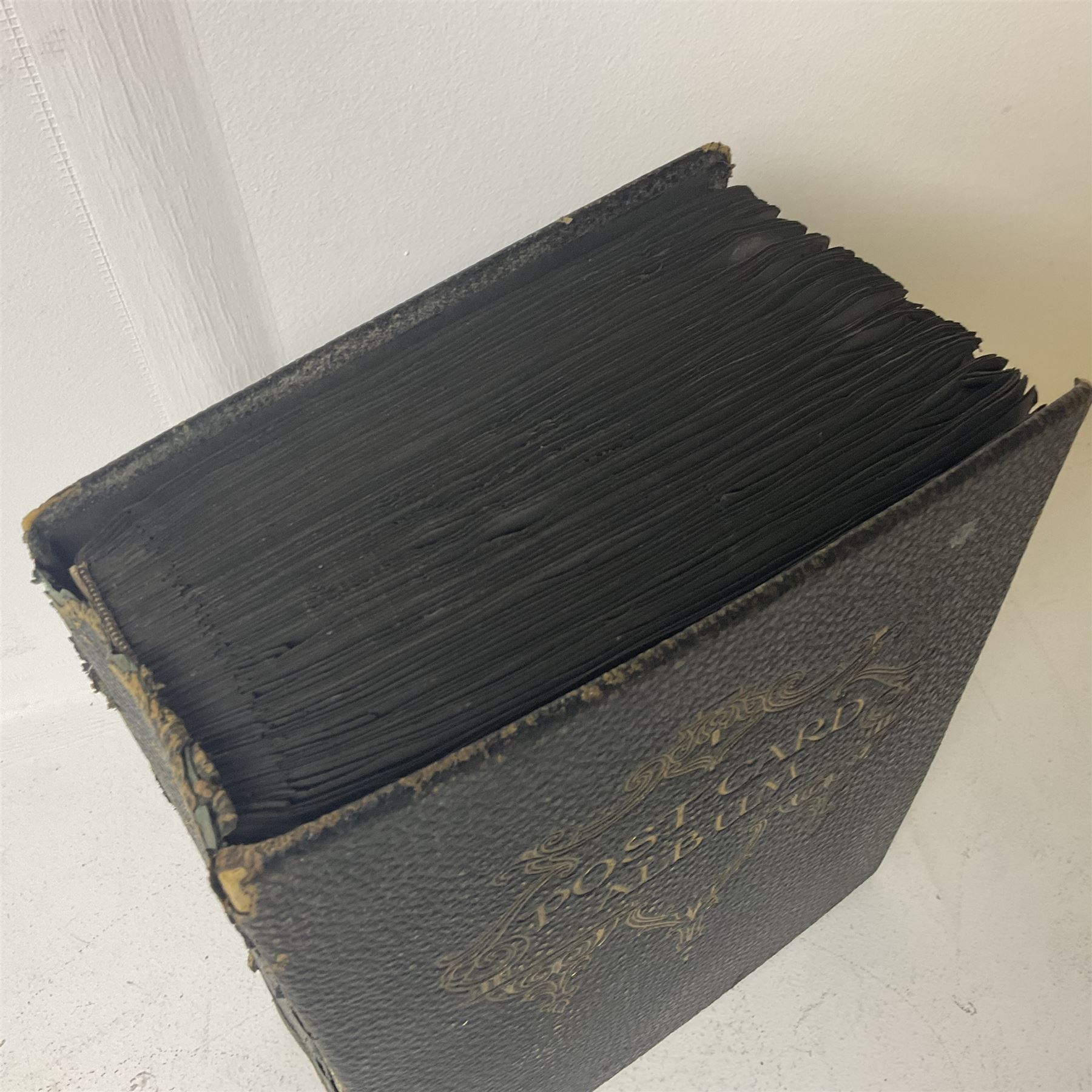 Postcard album with Victorian and later postcards, including silk cards, landscapes of the UK, portraits, Christmas cards etc  