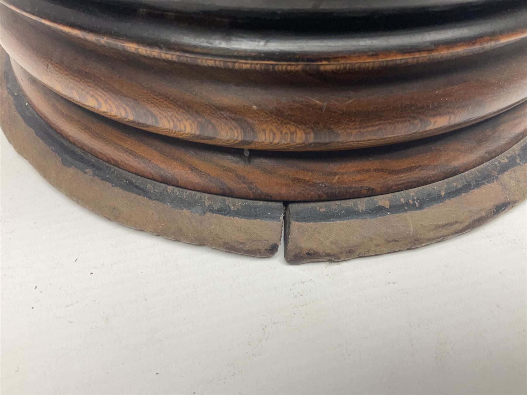  Georgian circular footwarmer with turned wood with decorative ebonised band, brass cover and swing handle, D25cm