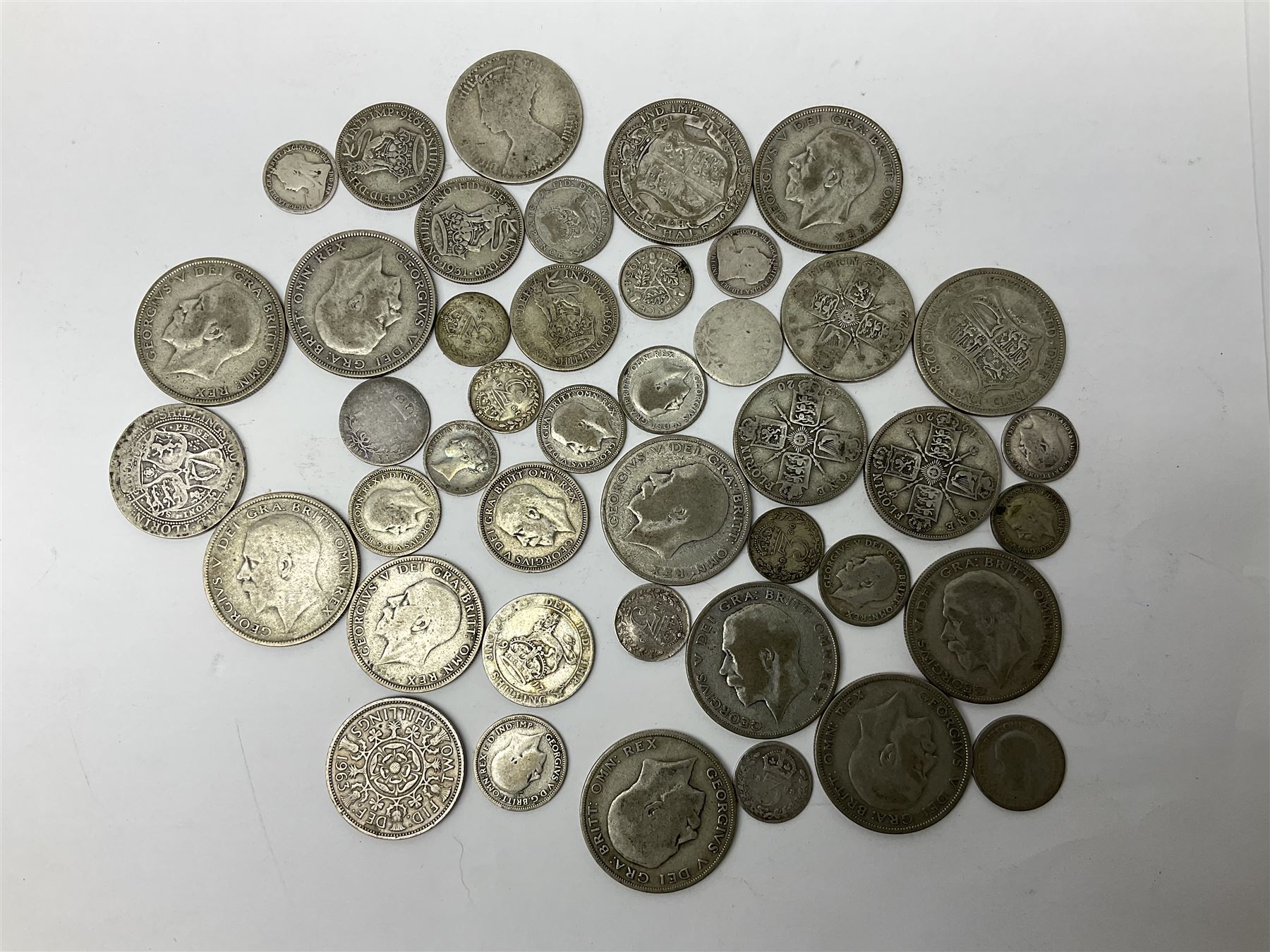 Approximately 280 grams of Great British pre 1947 silver coins, Barbados 1994 silver one dollar, Fiji 1994 silver proof five dollars, Western Samoa silver proof ten dollars, Guernsey 1995 silver proof one pound coin etc