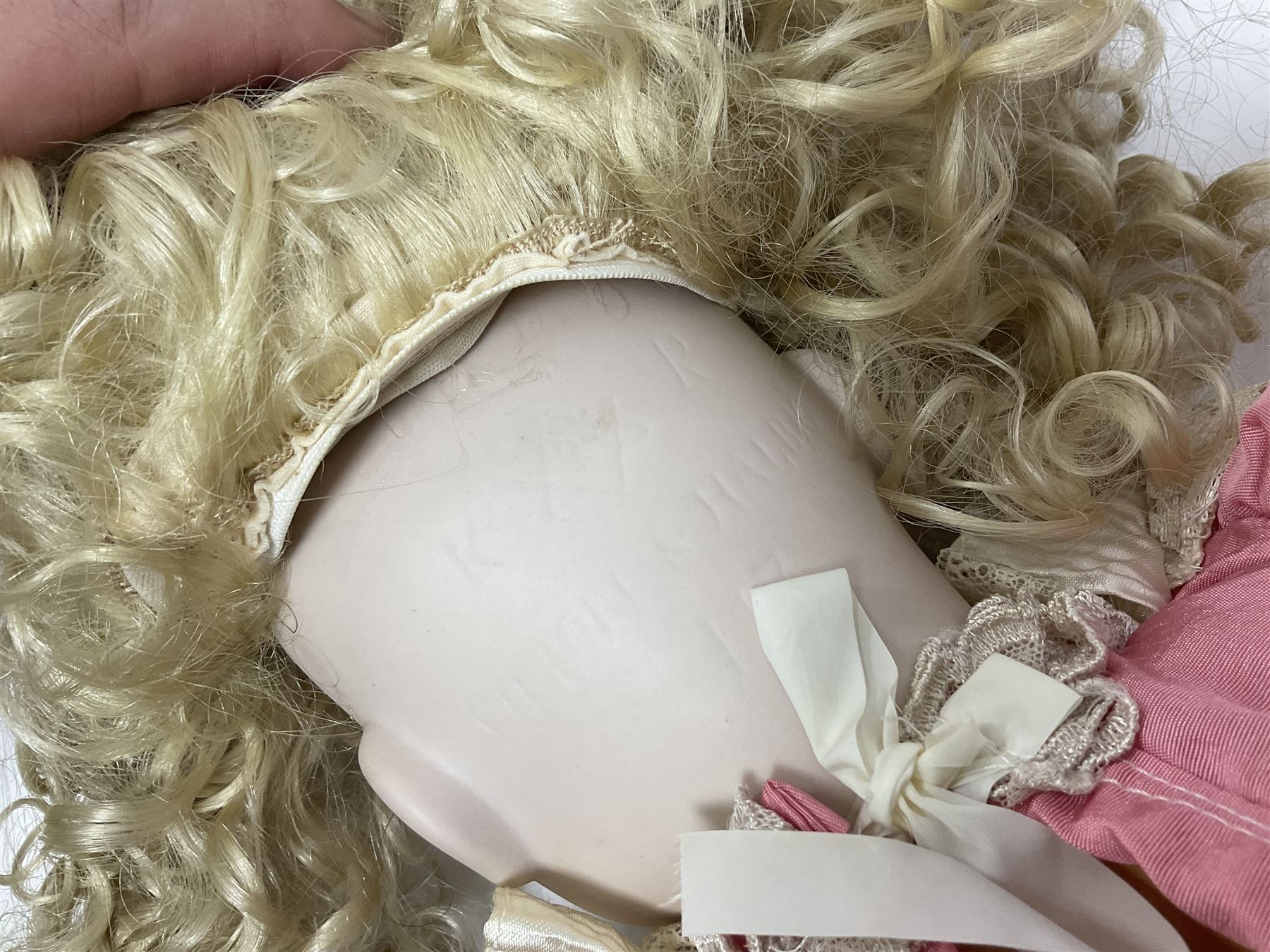 Reproduction Simon & Halbig bisque head doll with applied hair and jointed limbs; marked Simon & Halbig 117, H58cm