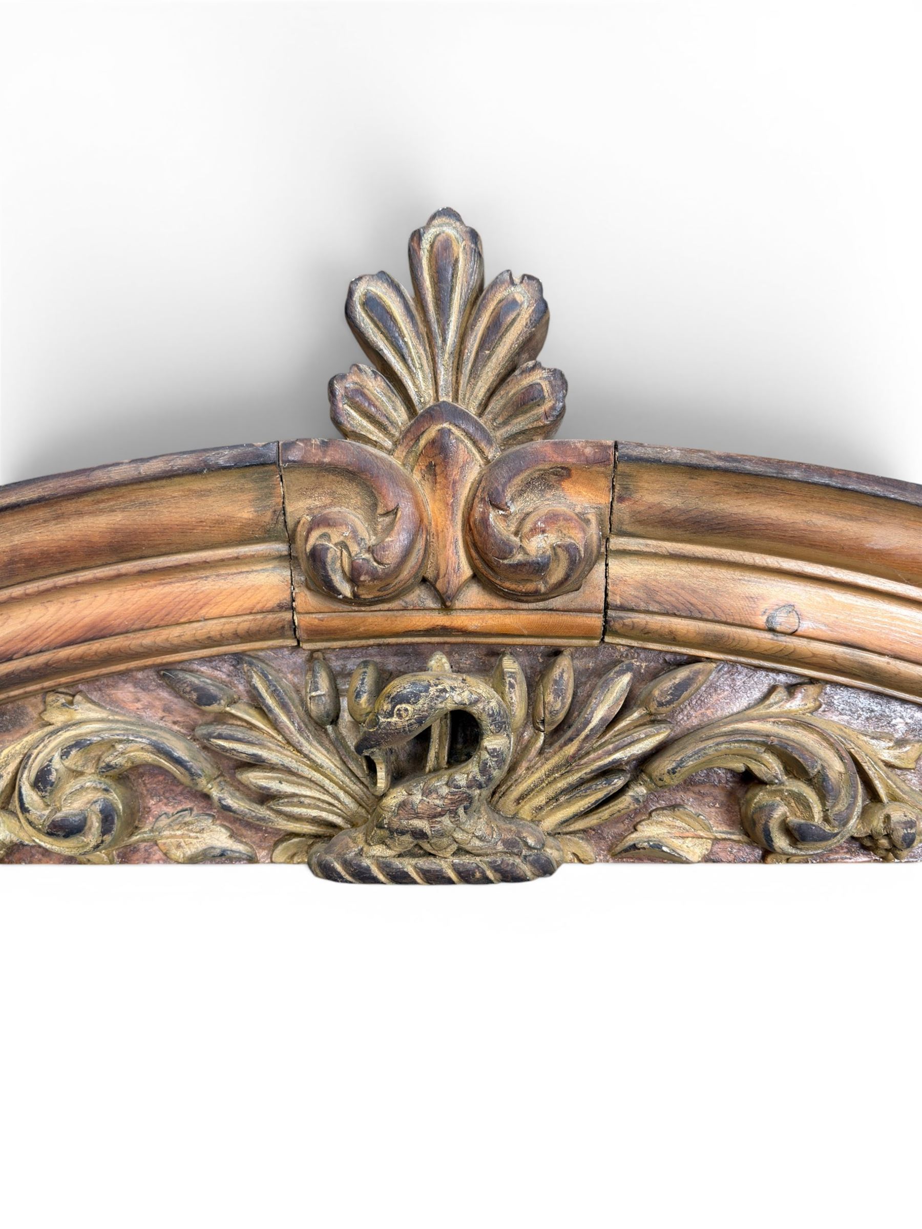 19th century carved pine architectural pediment, detailing floral swags with berries and central serpentine snake head 