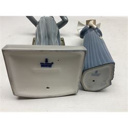 Two Lladro figures, comprising Conductor no 5196 and Prayerful Moment no 5500 together with a Lladro plaque and two Lladro candle holders, Dolphins at Play no 17666 and Sailing the Seas no 17665, all with original boxes, largest example H33cm 