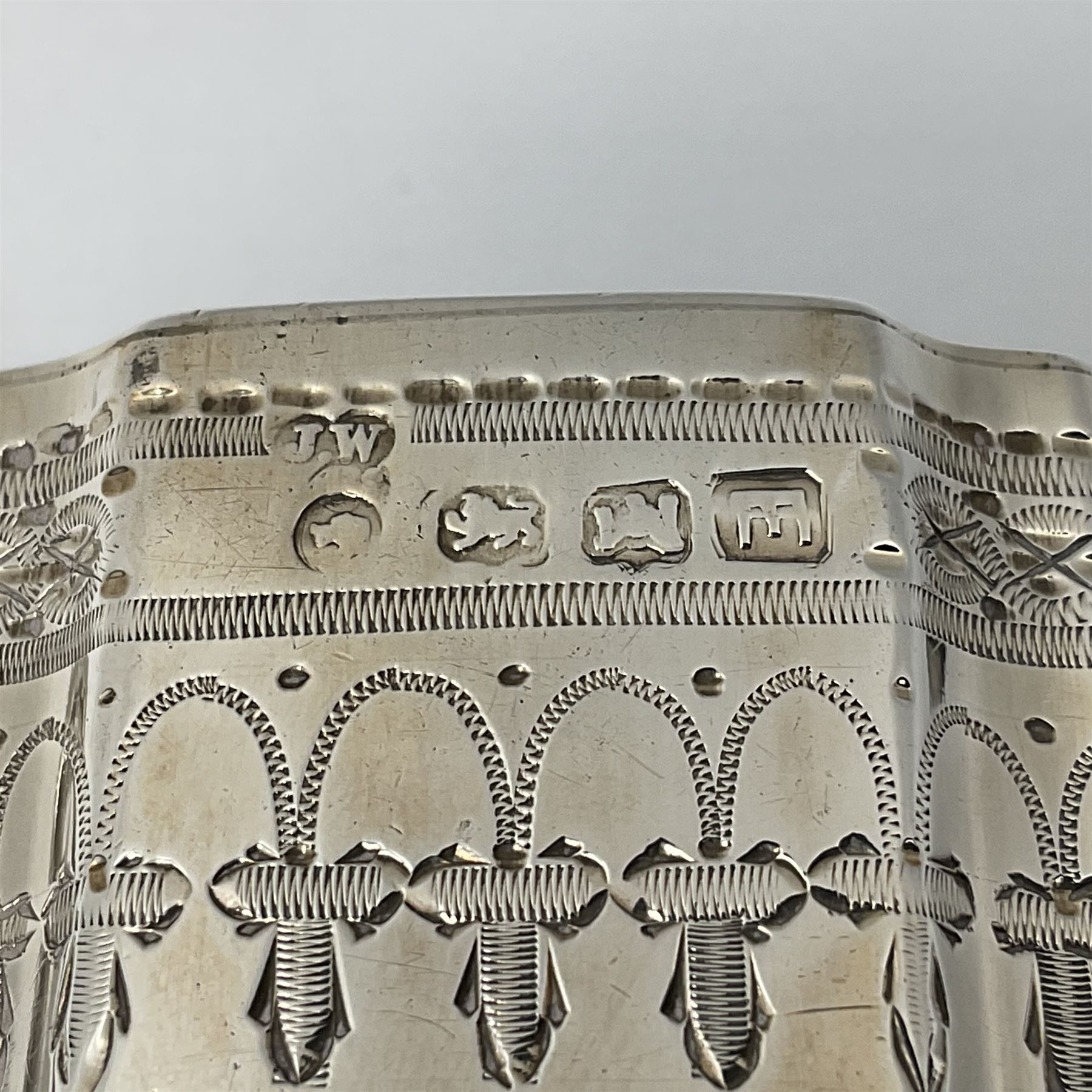 Victorian three-piece silver tea service, comprising teapot, twin handled open sucrier and milk jug, of oval form with shaped rim and C handles, each engraved with crests and bands of strapwork decoration, the milk jug and sucrier with gilt interiors, hallmarked Josiah Williams & Co, Exeter 1881, the teapot with ivory insulators and finial, all contained with a tooled leather, blue silk and velvet lined fitted case, retailed by West & Sun, Dublin 
This item has been registered for sale under Section 10 of the APHA Ivory Act