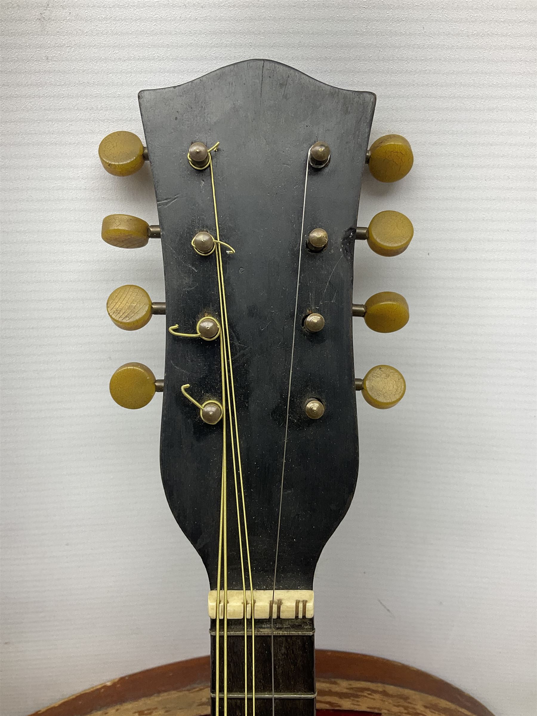 Early 20th century Italian Rafaele Disantino eight-string mandolin with two-piece back and spruce top with stamped Rafaele Disantino signature; bears maker's label L61cm; in wooden carrying case