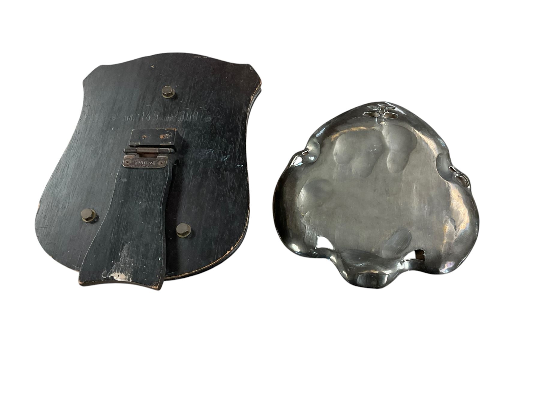 Bronze Ross family crest mounted on wooden strut frame, together with Art Nouveau card tray, after WMF, depicting two maidens amongst stylised flowers, tray H24cm