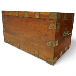 Early 19th century teak and brass bound silver campaign chest, fitted with brass L-shaped brackets and heavy weight carrying handles, the hinged lid enclosing two removeable trays with divisions and lined in blue baize, fitted with two 'R. Cooper & Son' brass locks