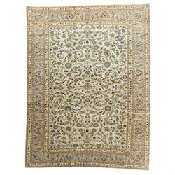 Central Persian Kashan hand-knotted rug, ivory field intricately decorated with an all-ove...