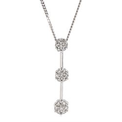 18ct white gold graduating diamond, trilogy cluster pendant, on a 9ct white gold chain, both hallmarked