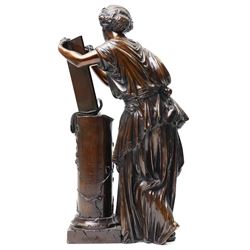 After the Antique - a pair of important 19th-century patinated bronze allegorical figures representing Calliope and Melpomene, the Muses of Epic Poetry and Tragic Drama, each modelled as a classically draped female figure standing beside a pedestal with climbing ivy, Calliope depicted writing upon a tablet, embodying poetic inspiration; Melpomene shown in contemplative pose and wearing a serpent bracelet, emblematic of wisdom, transformation and the inspired voice of drama, the pedestals inscribed respectively with the names of celebrated English poets and playwrights including Chaucer, Spenser, Milton, Pope, Cowper, Burns, Byron and Scott; the other with Shakespeare, Beaumont, Fletcher, Ben Jonson, Massinger, Congreve and Garrick, on integral square bases, each bearing incised or stamped foundry or model numbers to the underside, H47cm