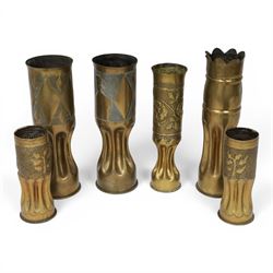 Pair of Second World War Trench Art M14 Shell Cases, each relief-decorated and engraved with a portrait of General de Gaulle, together with another pair decorated with lions and two others, largest H36cm 