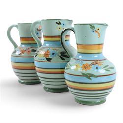 Hartrox Stoneware comprising three jugs, two vases and three bowls, all with green, blue and yellow floral decoration, with printed marks beneath, tallest H20cm