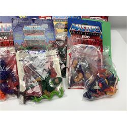 Thirty-one Masters of the Universe He-Man figures re-bagged on original backing cards;  two others lacking backing cards; boxed Modulok figure; bag of weapons and accessories; Roton, two horses and two battle cats; 1986 & 1987 Annuals; Ladybird and other story books; Panini sticker album; instructions etc