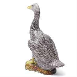 Pair of 20th century Chinese Export porcelain ducks, each naturalistically modelled with aubergine and white enamel plumage and seated on polychrome rockwork bases, H24cm 