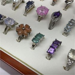 Forty silver stone-set rings including topaz, amethyst, tanzanite etc, all tested and stamped 925, housed in a presentation ring box