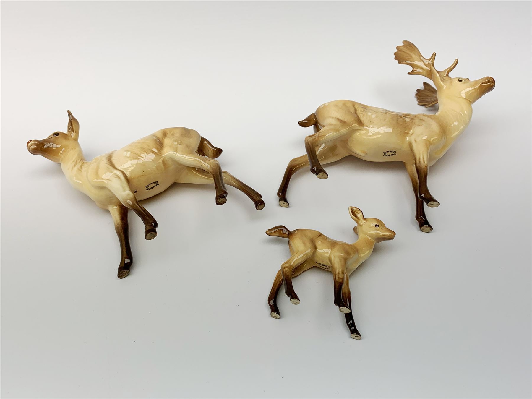 A Beswick Deer family, comprising Stag, Doe and Fawn. (3).  