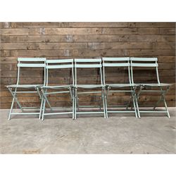 Nine metal framed folding chair in a celadon green finish