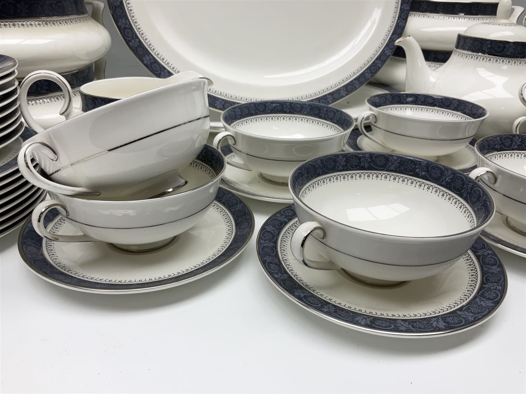 Royal Doulton Sherbrooke pattern part dinner and tea service, to include teapot, ten twin handled soup bowls and saucers, two serving platters, three twin handled covered dishes etc (63)  