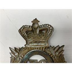 Victorian 1878-1881 97th Foot Helmet Plate with Victorian crown over brass backing star with laurel wreath and belted circlet containing loose fitting brass central plate `97` and two rear fixing lugs.