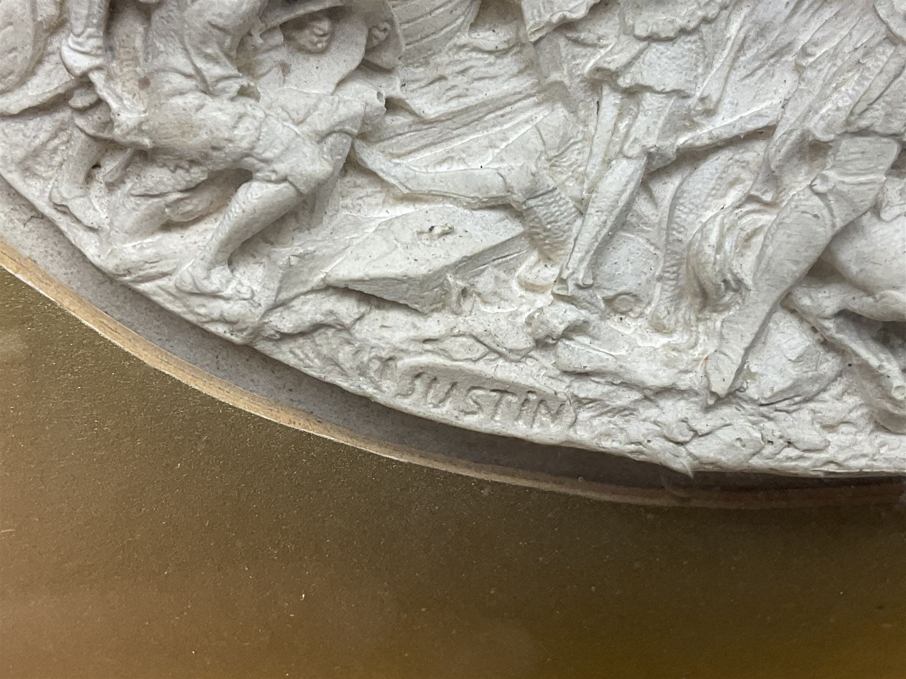 Justin Mathieu, two oval high relief plaque depicting a battle scenes, each within a wooden frame, frame  H21cm, L25cm