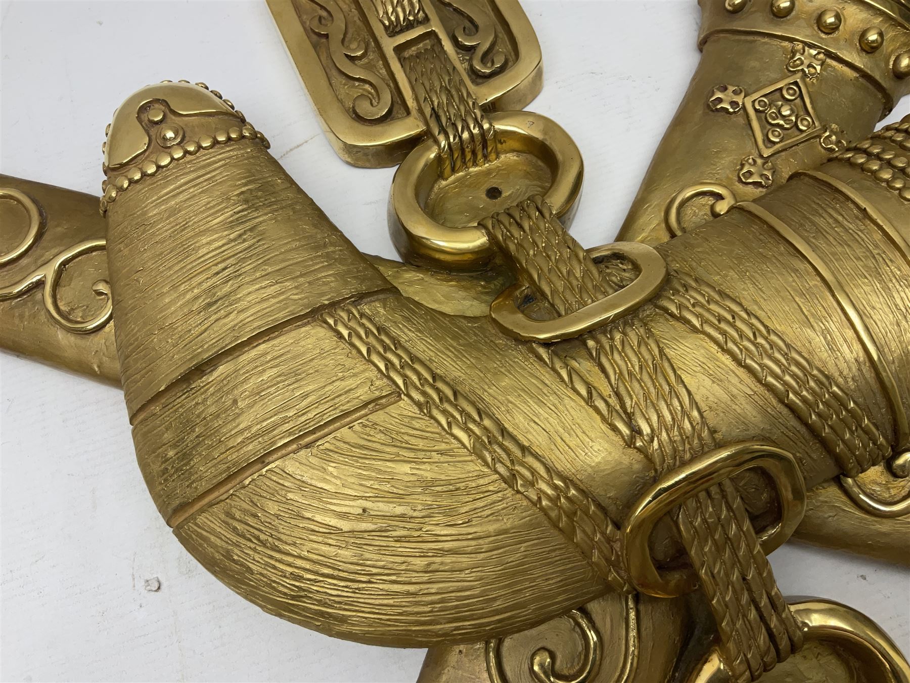 Gilt state emblem for Oman, a sheathed khanjar dagger superimposed above pair of crossed swords and belt and a seperate crown, main emblem H84cm, W83cm, crown H35cm, W33cm
Provenance by vendor repute: The emblem was previous mounted above HM's throne, in the main majalis, of the HM Royal Yacht AL Said, until 1985 when HM Sultan Qaboos ordered the upgrading of all state emblems, The emblem was gifted to the vendor who worked for the Sultans Royal Yacht Squadron