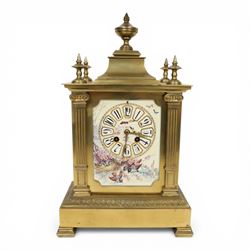 French gilt-bronze and porcelain mantel clock, architectural case surmounted by a stepped pediment with central urn finial and four subsidiary finials above two fluted Corinthian-style pilasters, the entire front inset with shaped porcelain panel incorporating a circular dial and numerals decorated with birds among flowering branches and two winding apertures and pierced brass hands, above a leaf and scroll cast frieze, raised on bracket feet, with an eight-day movement stamped 'AD MOUGIN Deux Medailles' striking the hours and half-hours on a coiled gong, with pendulum, circa 1900