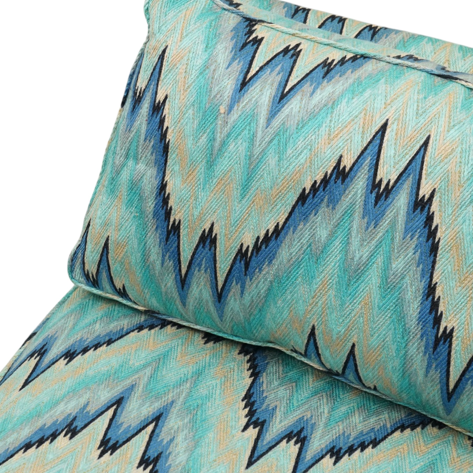 Parker & Farr - 1970s modular sofa suite comprising four chairs and footstool, reclined back with loose seat cushion, upholstered in turquoise flame-stich fabric with skirt, on castors