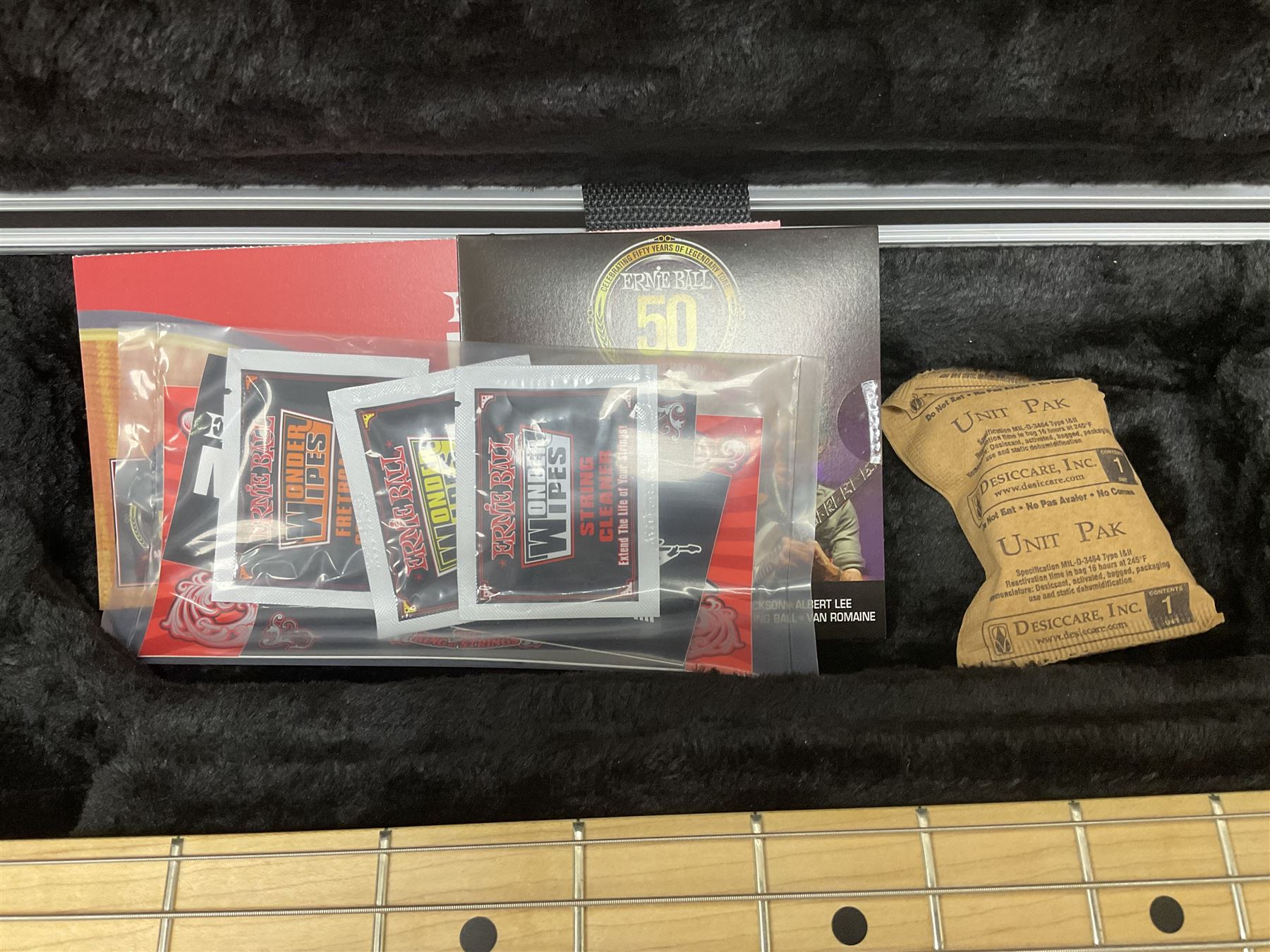 Ernie Ball Music Man Sting Ray 4 string bass guitar, in natural finish with roasted maple neck and tortoiseshell effect scratch guard, serial no 87485, in black Music Man hard case, guitar L114cm