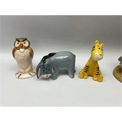 Seven Beswick Winnie the Pooh figures, comprising Pooh Bear, Tigger, Piglet, Kanga, Mr Rabbit, Owl, and Eeyore, together with two Royal Doulton Winnie the pooh Christmas Collection figures, 'The Most Perfect Tree in all the Wood', and 'Christopher Robin Dresses the Tree', (9)  