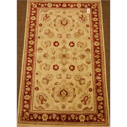  Persian beige ground rug with floral decoration, 157cm x 94cm  