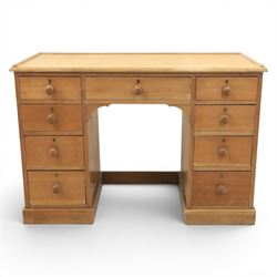 20th century ash twin pedestal desk, gadroon galleried top, twin bank of graduated drawers...